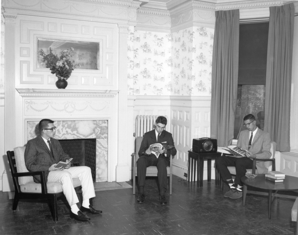 Students reading in a dormitory common room at 373 Commonwealth Avenue, ca. 1950s