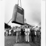 Campus building with people below
